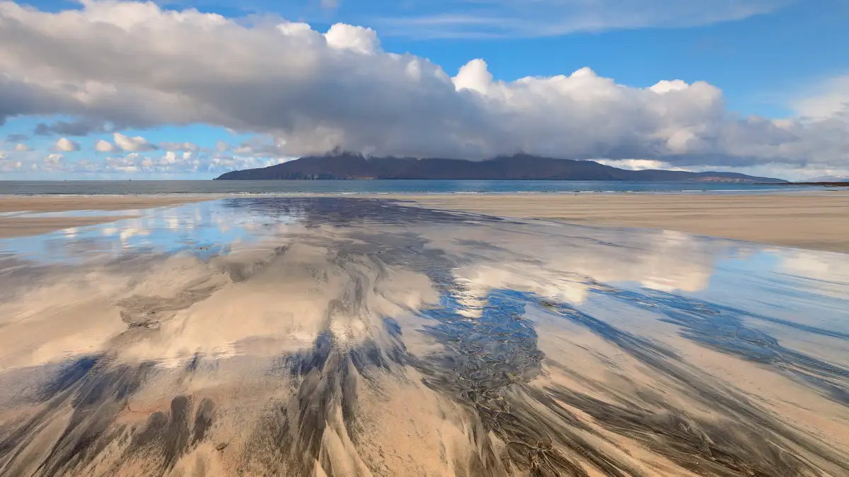 On Laig Bay's Scottish coastline, the beach's buffed-marble countertop appears to be swirling silt and silica. On a drier…