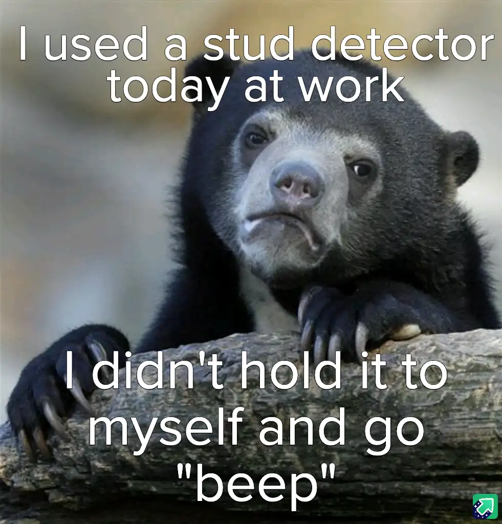 A close-up photo of a sad-looking, dark-furred bear with a downturned mouth, resting its paws on a log. White text overlaid…