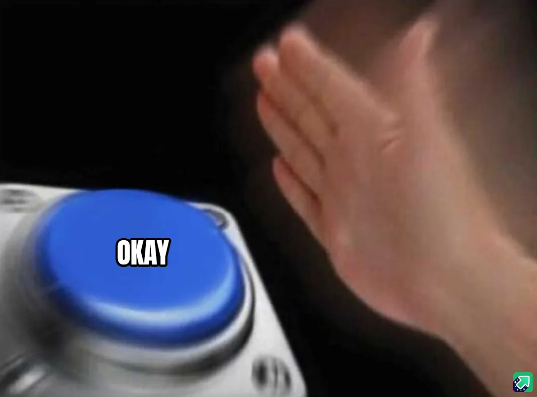A blurry image shows a hand reaching toward a large blue button mounted on a silver panel, with the word 'OKAY' in bold…