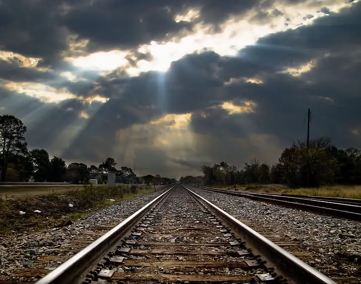 Stunning Crepuscular Rays Illuminating Train Tracks
