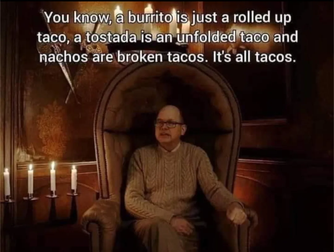A man in a cable-knit sweater sits in a large, ornate armchair in a dimly lit room with candles. The overlaid text reads…