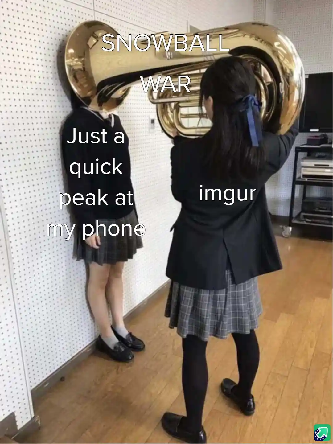Two schoolgirls in uniforms stand in a room; one holds a large tuba, the other leans against a wall. Text overlaid reads…