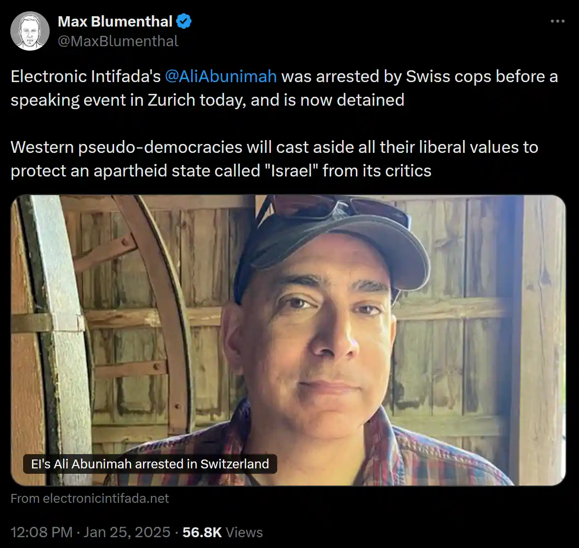 A screenshot of a tweet by Max Blumenthal shows a photo of Ali Abunimah, a man wearing a cap and plaid shirt, standing in…