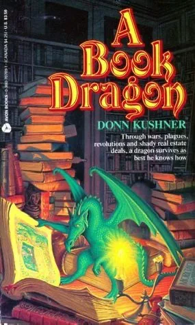 The image shows the cover of a book titled 'A Book Dragon' by Donn Kushner. A green dragon is depicted sitting atop a large…