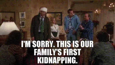 A still from the movie 'The Family Man' shows a man in a Santa hat apologizing for a kidnapping, with the text overlaid…