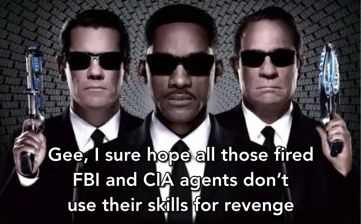 The image shows three men in black suits and sunglasses, holding futuristic guns, against a background of scrolling code…