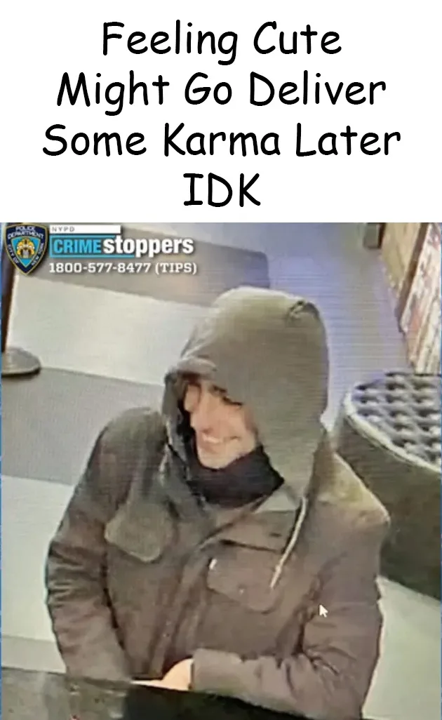 A grainy security camera image shows a person in a dark hooded jacket smiling while seated at a counter. The image has an…