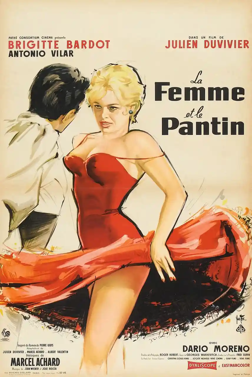 A vintage French movie poster for 'La Femme et le Pantin' featuring Brigitte Bardot in a red dress looking at a man in a…