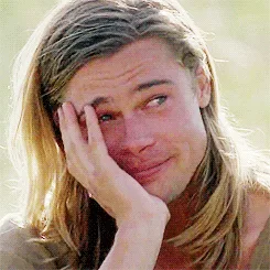 A six-panel image sequence shows Brad Pitt with long hair, progressively transitioning from a smug, self-satisfied smirk to…