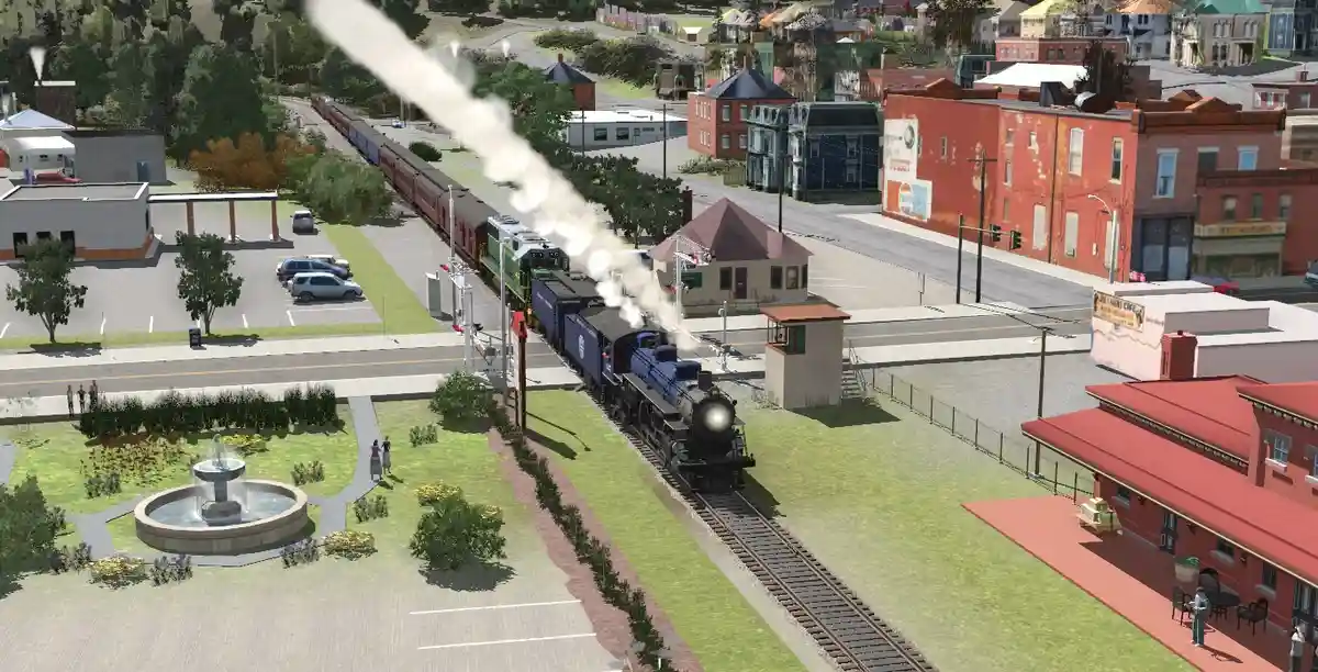 A screenshot from a train simulation game shows a blue steam locomotive pulling passenger cars through a small town…