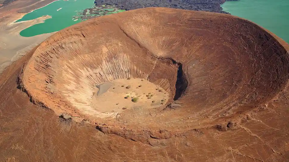 A Mars-like site on the surface of a volcano, not an alien crater, stands out against the jade waters of Lake Turkana's…