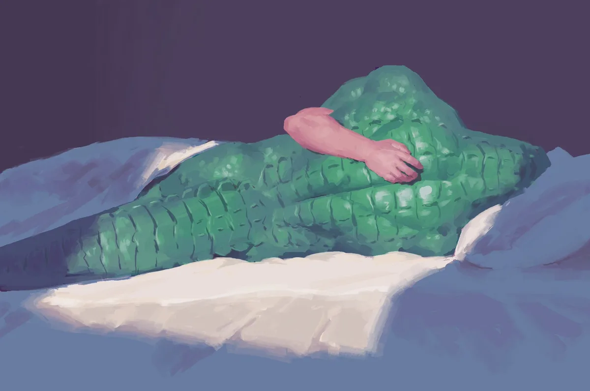 A digital painting shows a person with green, scaly, alligator-like skin lying in bed under white sheets, with one pink…