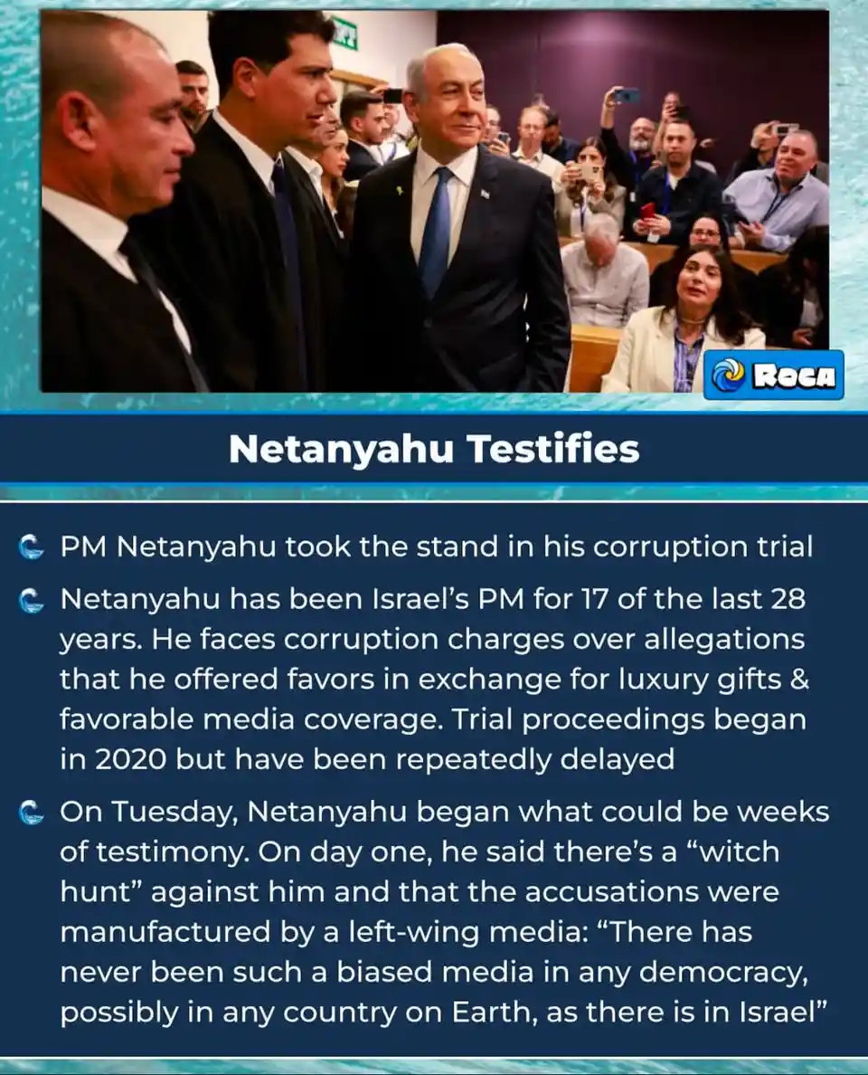 The image shows Benjamin Netanyahu, Israel's Prime Minister, standing in a courtroom while testifying in his corruption…