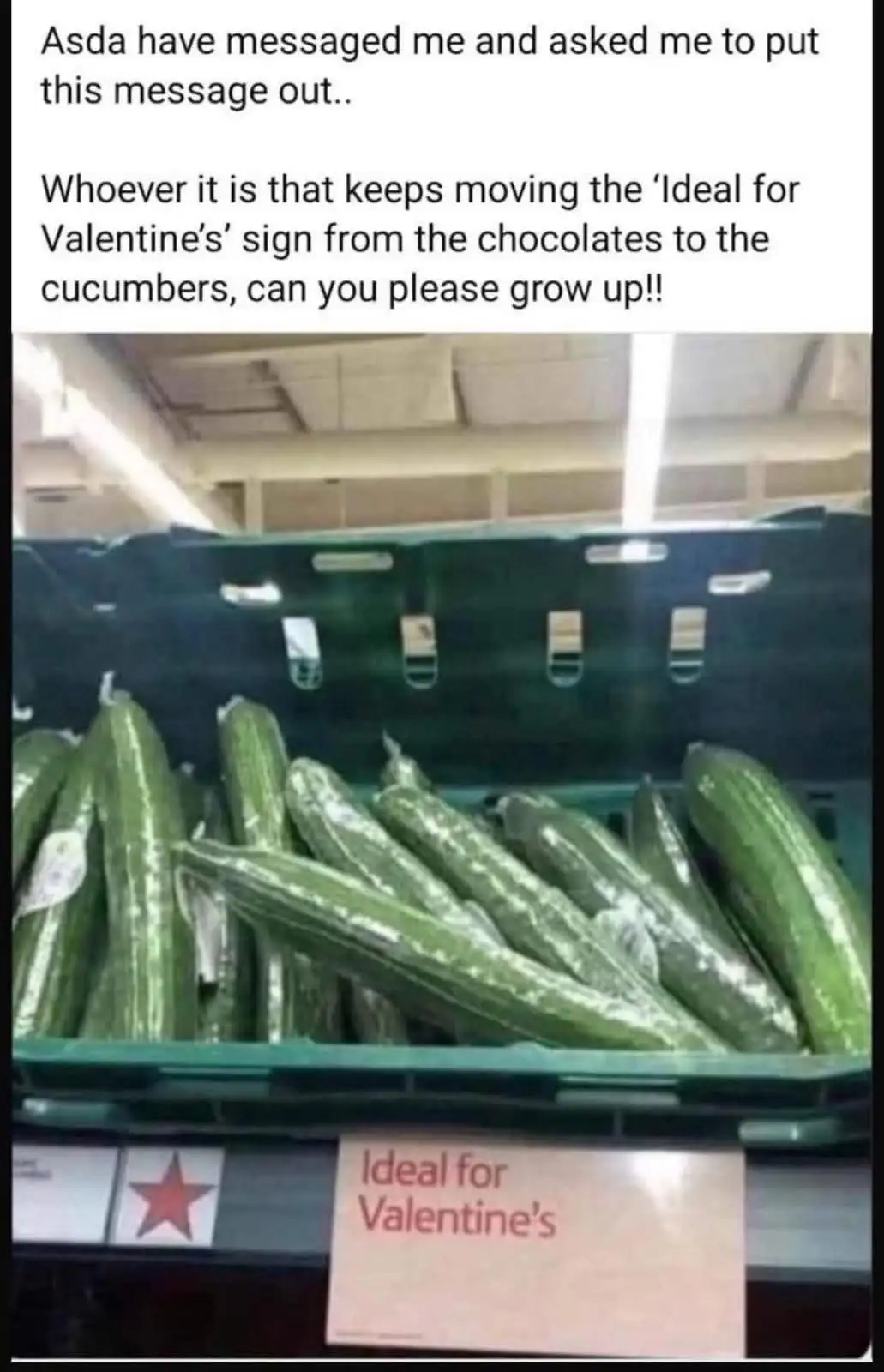 A supermarket shelf displays a bin of cucumbers with a sign that reads 'Ideal for Valentine's', humorously misplaced since…