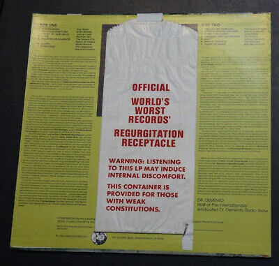 A yellow vinyl record sleeve with text printed on both sides, featuring a white paper bag taped over the center. The bag has…