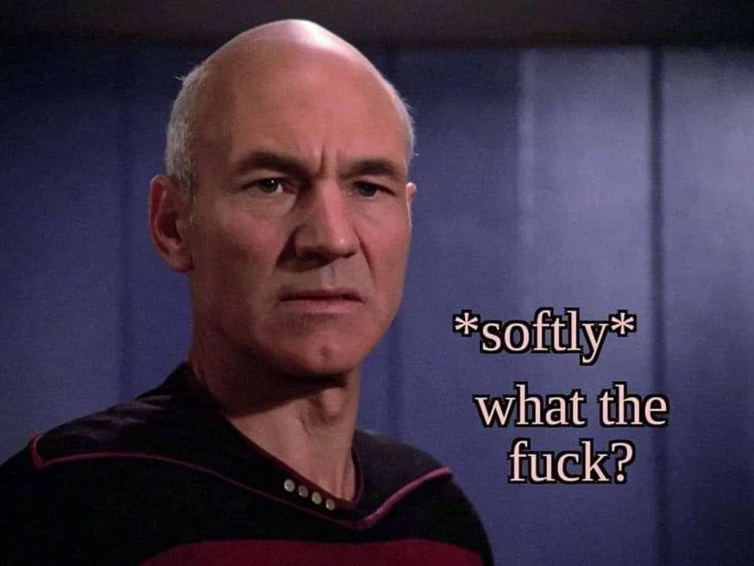 A close-up of Captain Jean-Luc Picard from Star Trek: The Next Generation, wearing his black and red uniform, with a stern…
