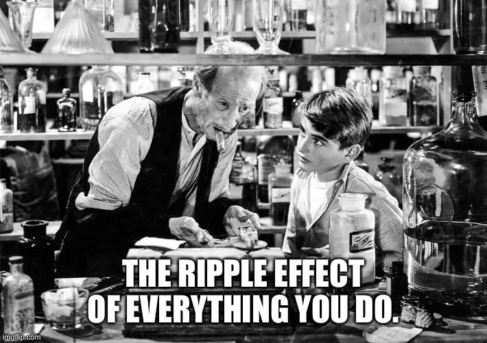A black-and-white photo shows an older man with a cigarette in his mouth leaning over a bar counter toward a young boy, who…
