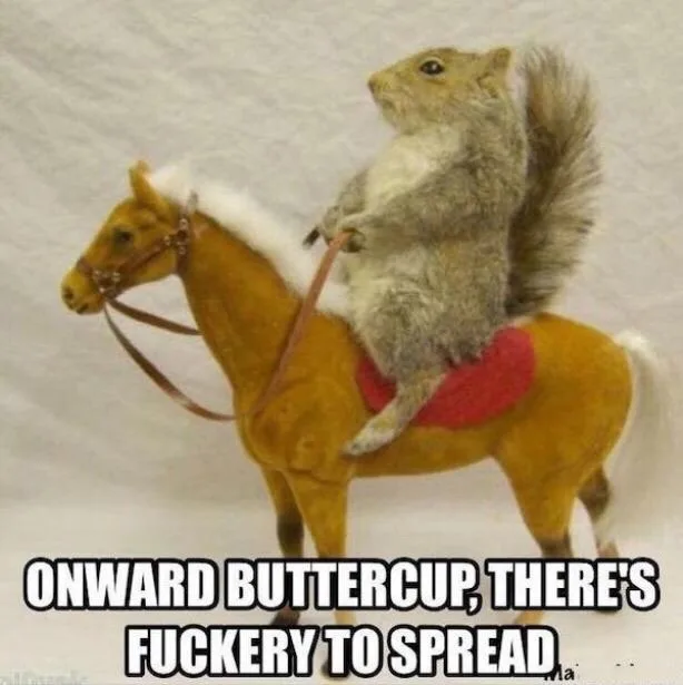A real squirrel is perched atop a small, yellow toy horse with a red saddle and white mane, holding the reins. The image has…