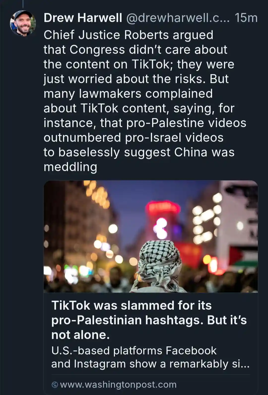 A screenshot of a tweet by Drew Harwell shows a blurred background image of a person wearing a keffiyeh from behind…