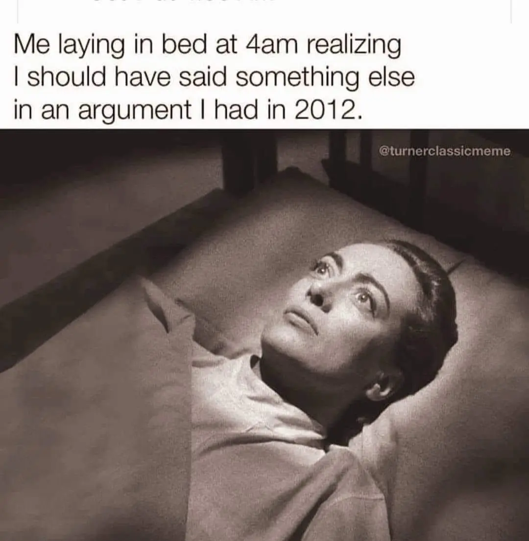 A black-and-white photo shows a woman lying in bed, looking upward with a wide-eyed, startled expression. The overlaid text…