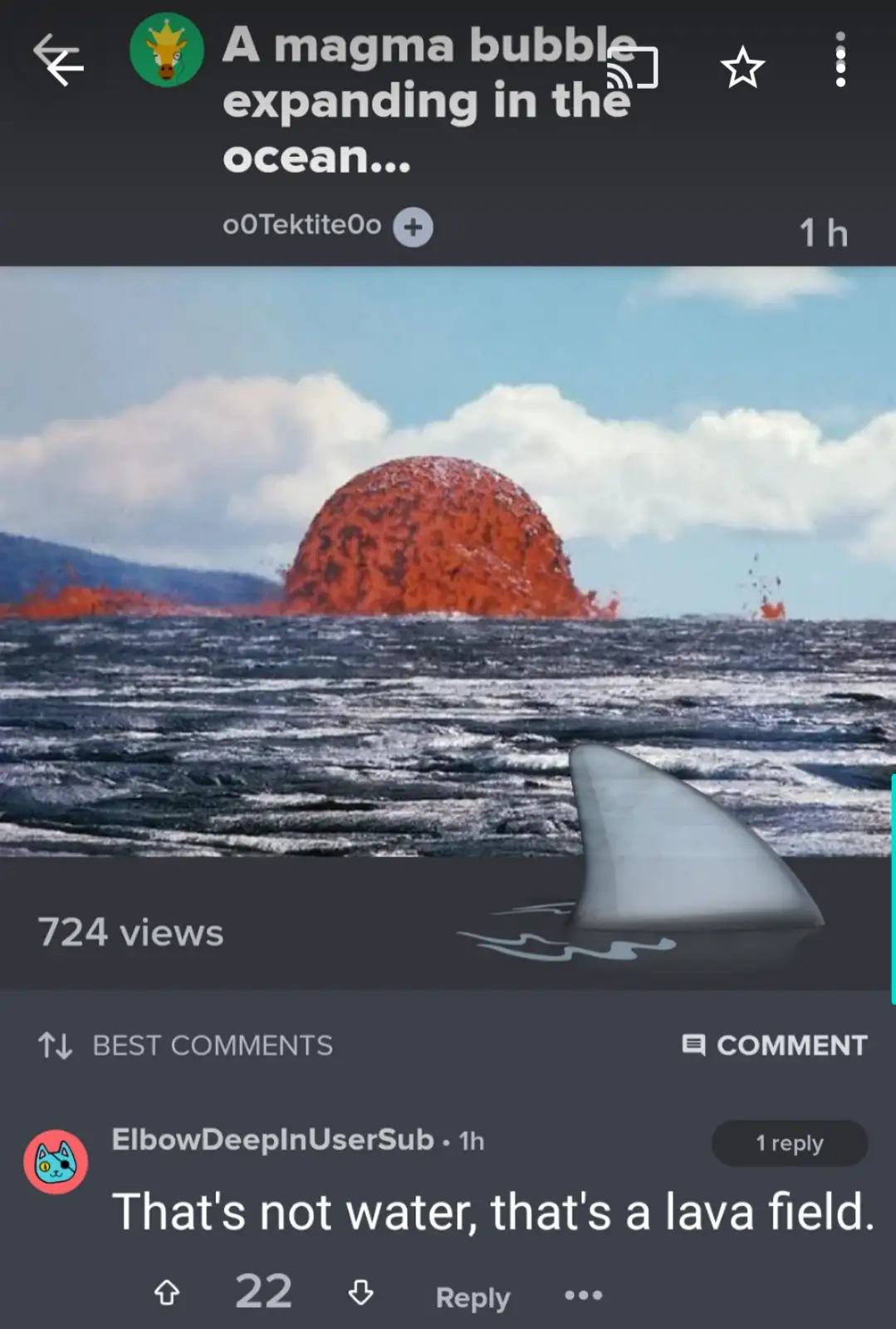 An image shows a large, dome-shaped, orange-red lava formation rising from dark ocean water under a partly cloudy sky. In…