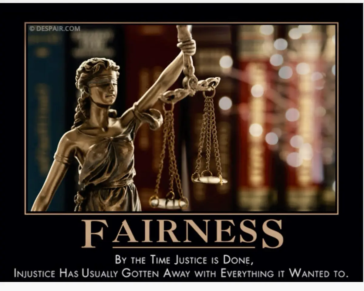 A bronze statue of Lady Justice, blindfolded and holding scales, stands before a blurred background of law books. The image…