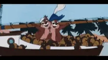A sequence of six frames from a cartoon shows two chipmunks in a boat filled with acorns. The chipmunk on the left, wearing…