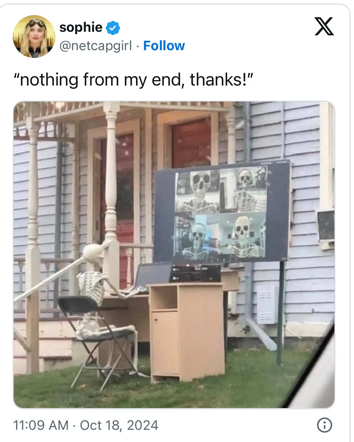 An outdoor scene shows a skeleton sitting at a desk on a porch, appearing to be on a video call. A large TV screen behind it…