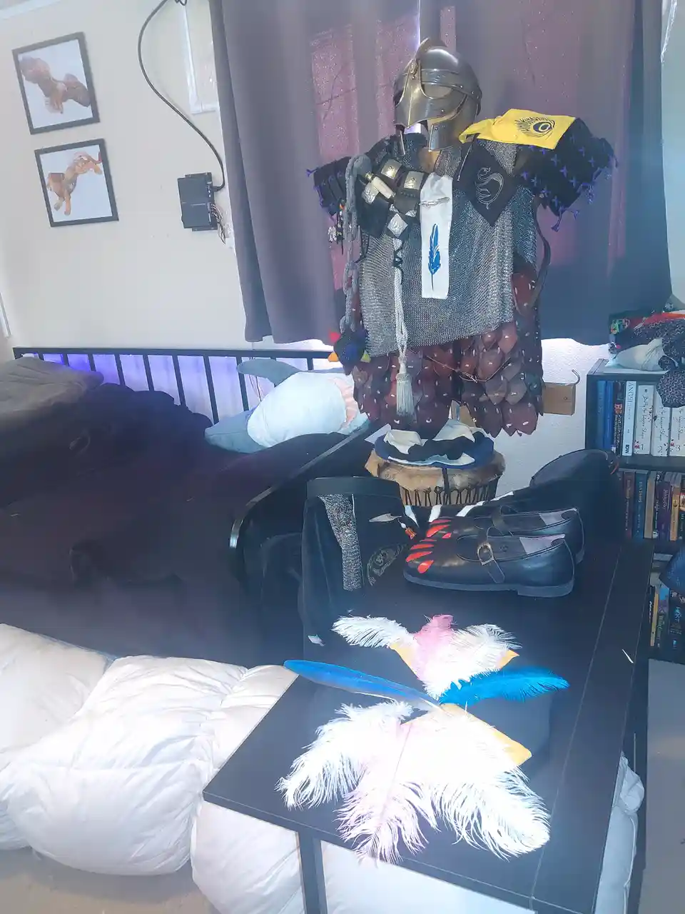 A bedroom scene features a full suit of medieval-style armor, including a helmet and chainmail, displayed on a mannequin or…