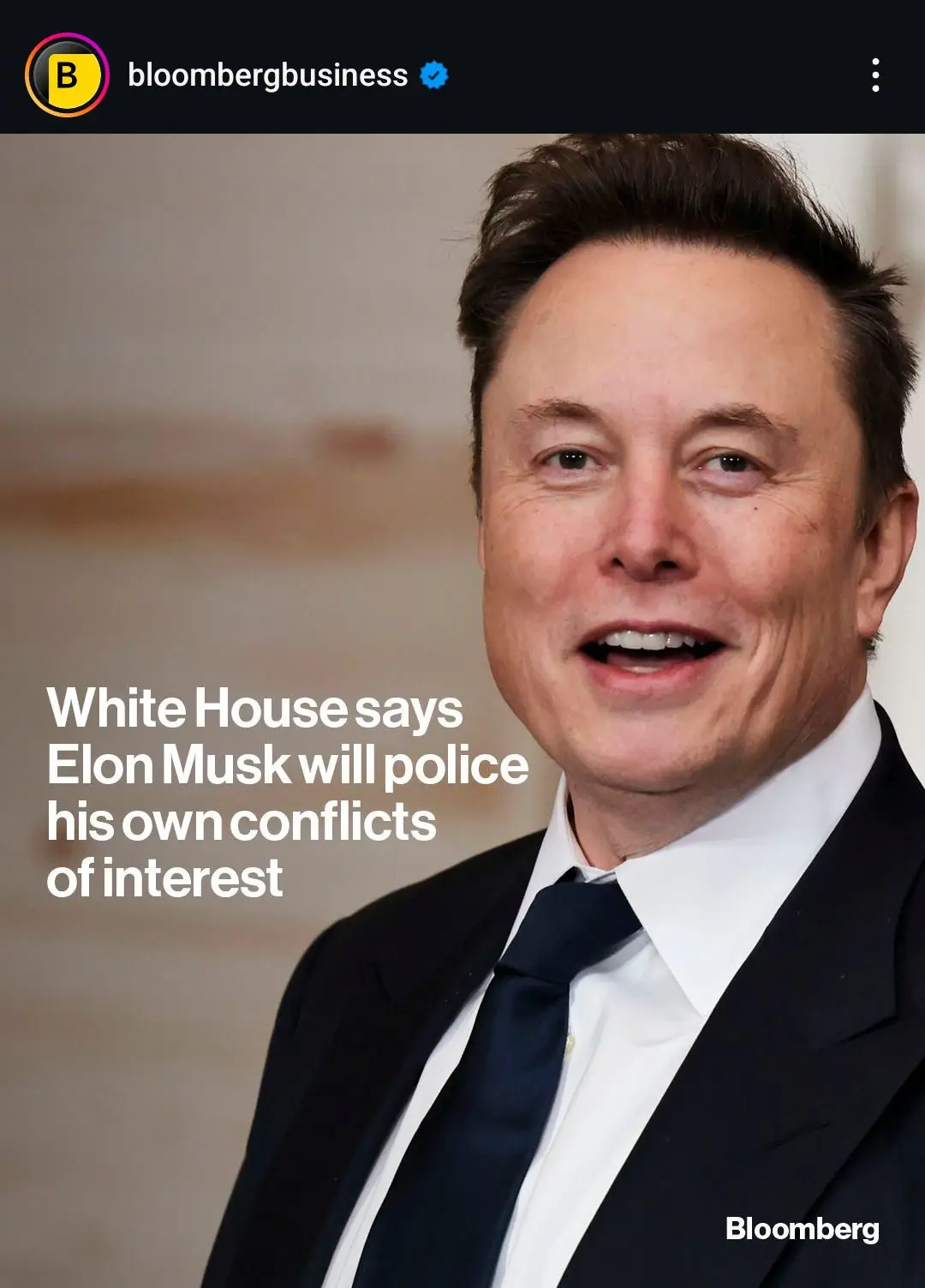 A close-up photo of Elon Musk smiling, wearing a dark suit and tie, with white text overlaid that reads 'White House says…