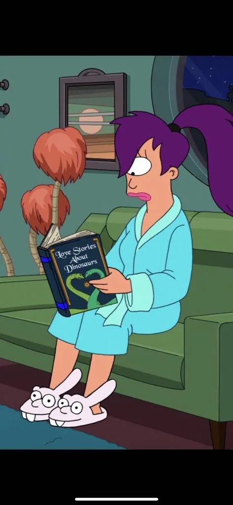 A cartoon woman with purple hair in a ponytail, wearing a light blue robe and bunny slippers, sits on a green couch holding…