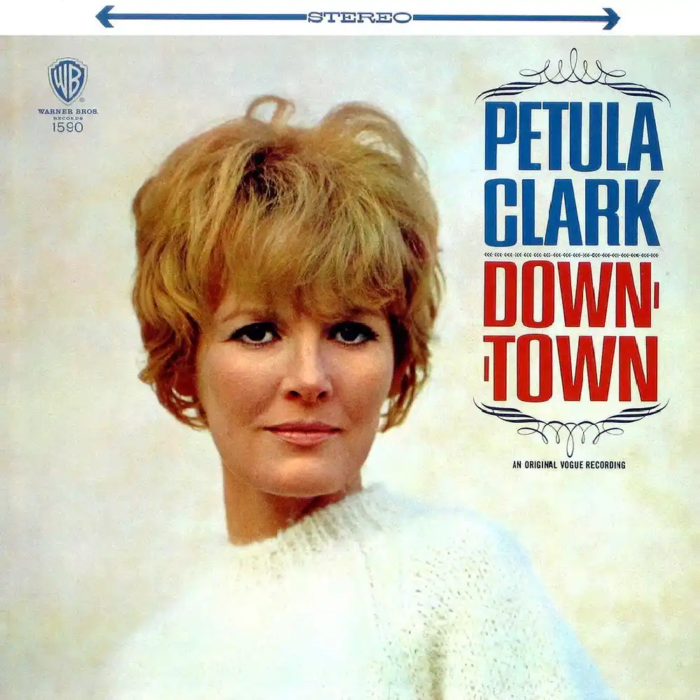 The image is a vintage album cover featuring singer Petula Clark, who has short, styled blonde hair and is wearing a white…