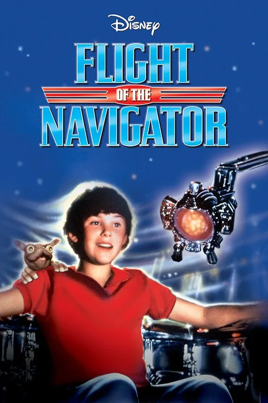 A movie poster for Disney's 'Flight of the Navigator' shows a young boy in a red shirt sitting with his arms outstretched, a…