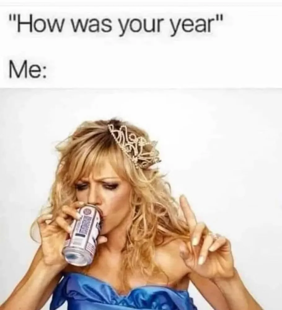 A woman with blonde hair wearing a tiara and a blue dress is drinking from a beer can while making a disgusted face, with…
