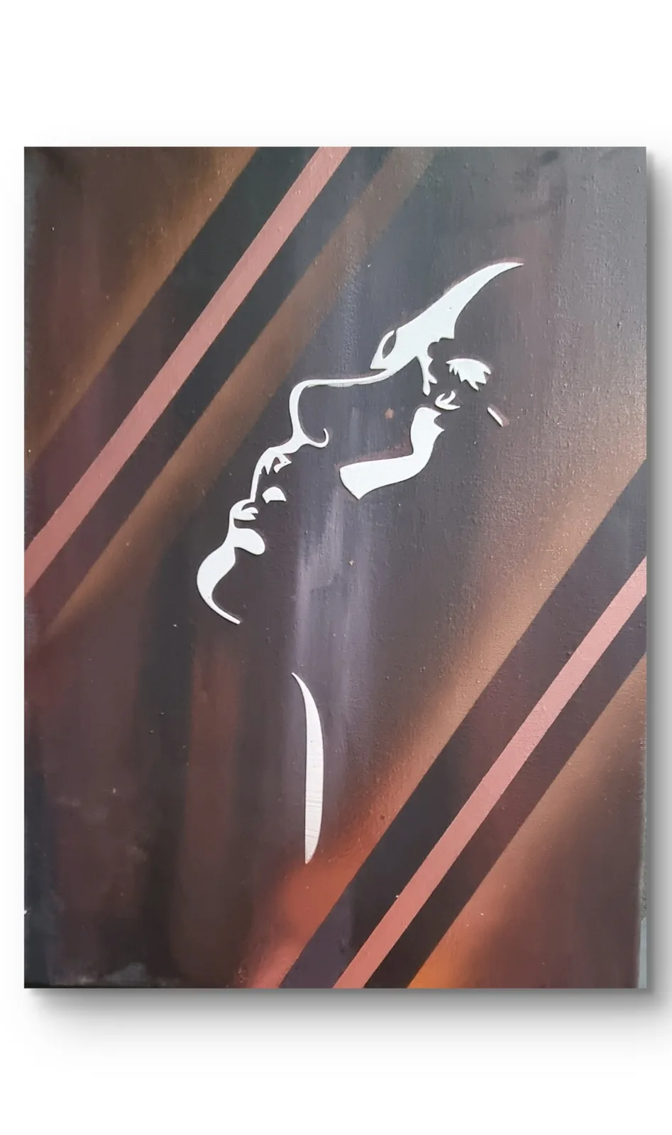A white stencil graffiti on a dark surface with diagonal brown and pink stripes depicts a stylized figure with a long…