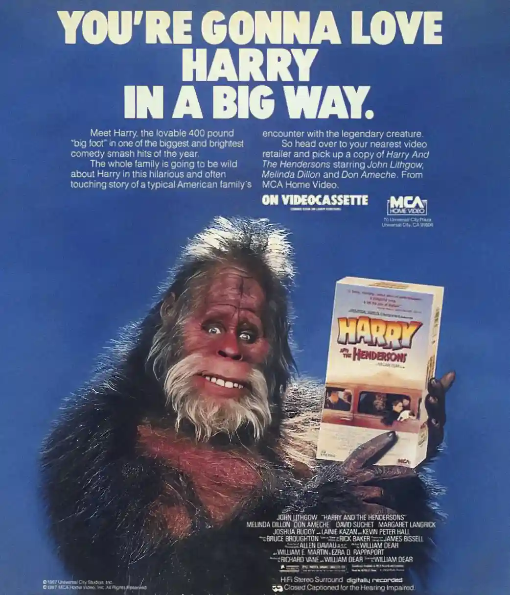A vintage 1987 VHS advertisement poster for the movie 'Harry and the Hendersons' features a large, friendly-looking Bigfoot…