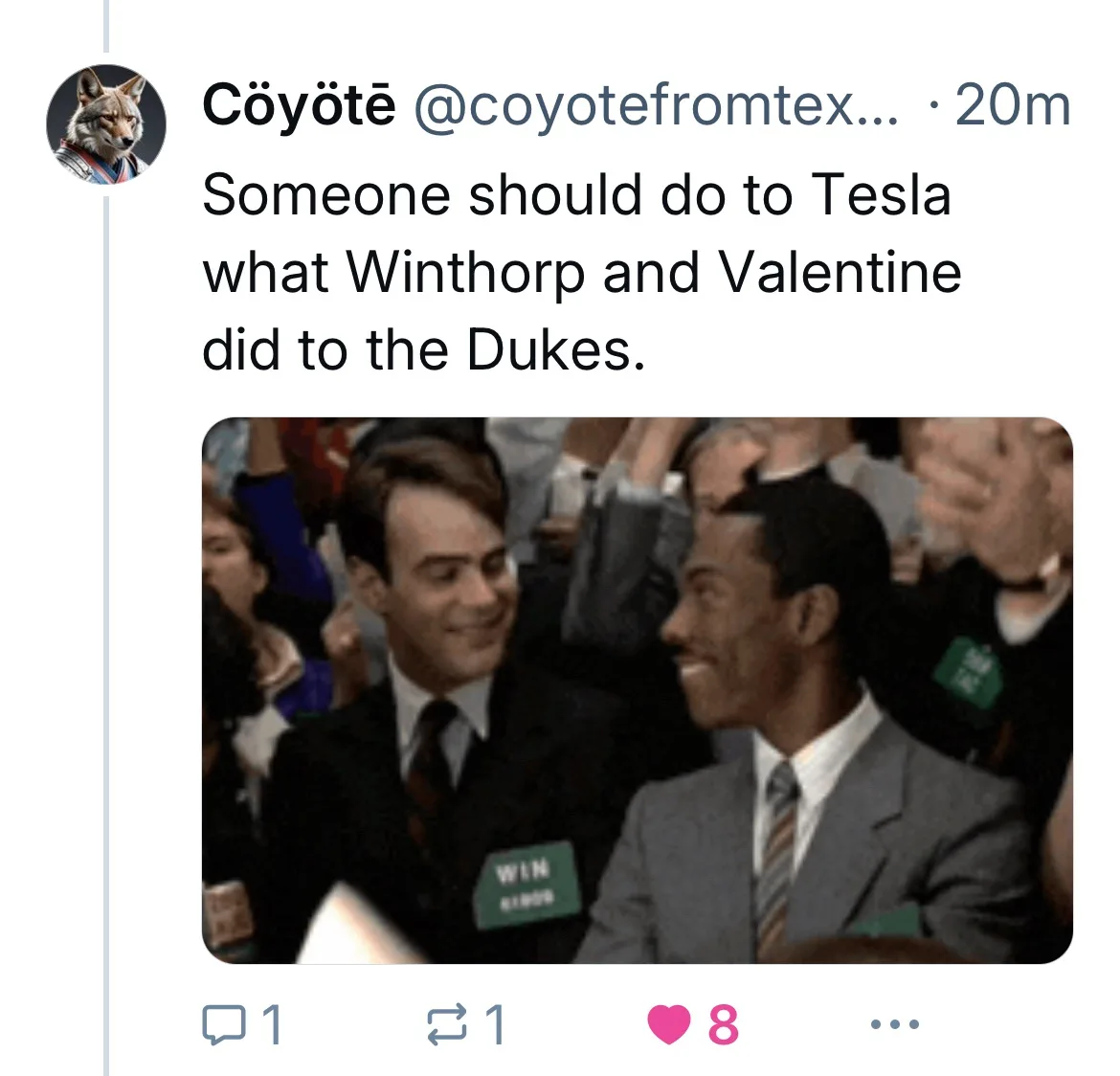 A screenshot of a tweet by user Cöyötë showing a photo of two men in suits smiling at each other. The man on the left wears…