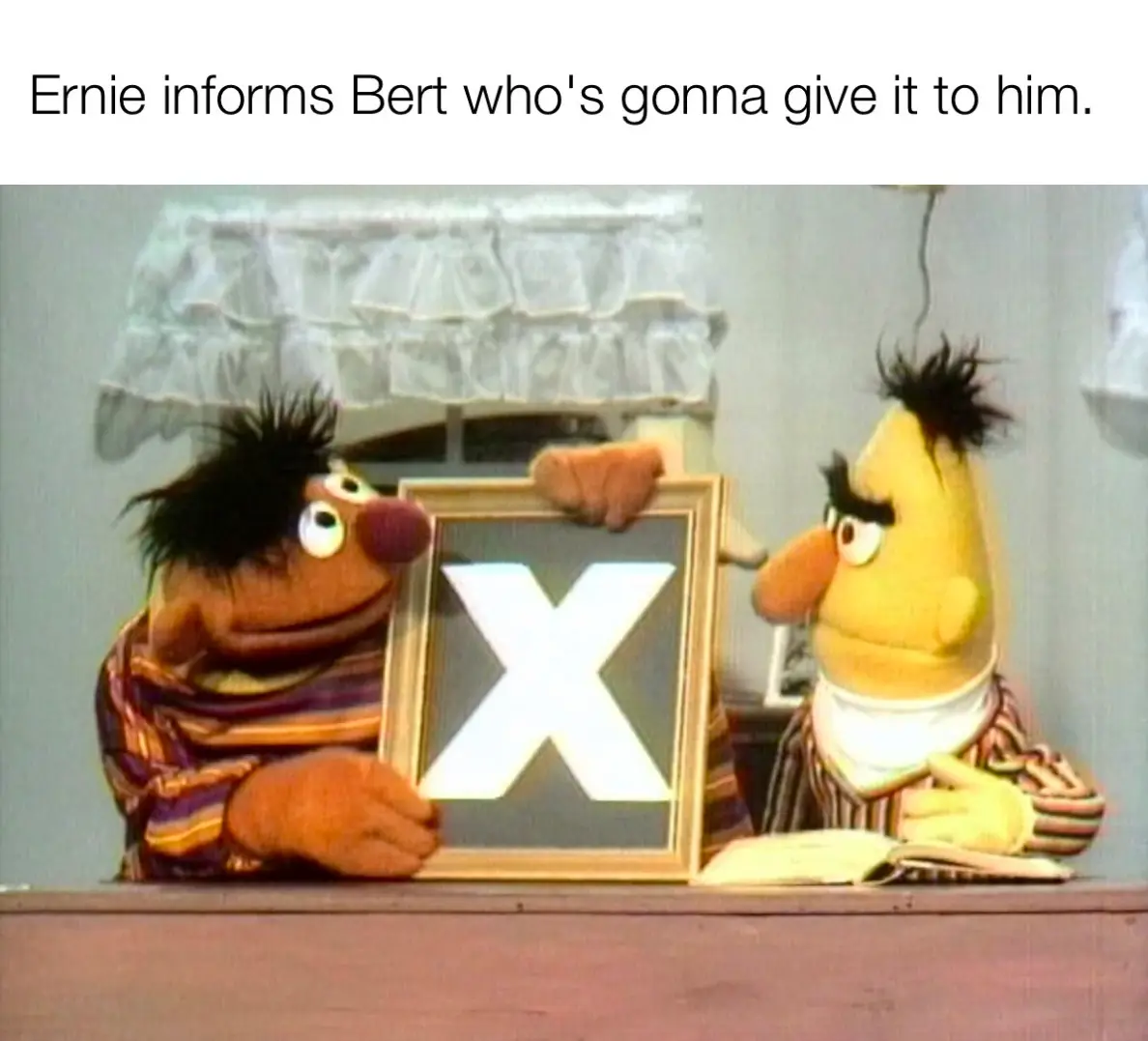 Two Muppet characters, Ernie (brown, holding a framed letter 'X') and Bert (yellow, reading a book), are shown in a classic…
