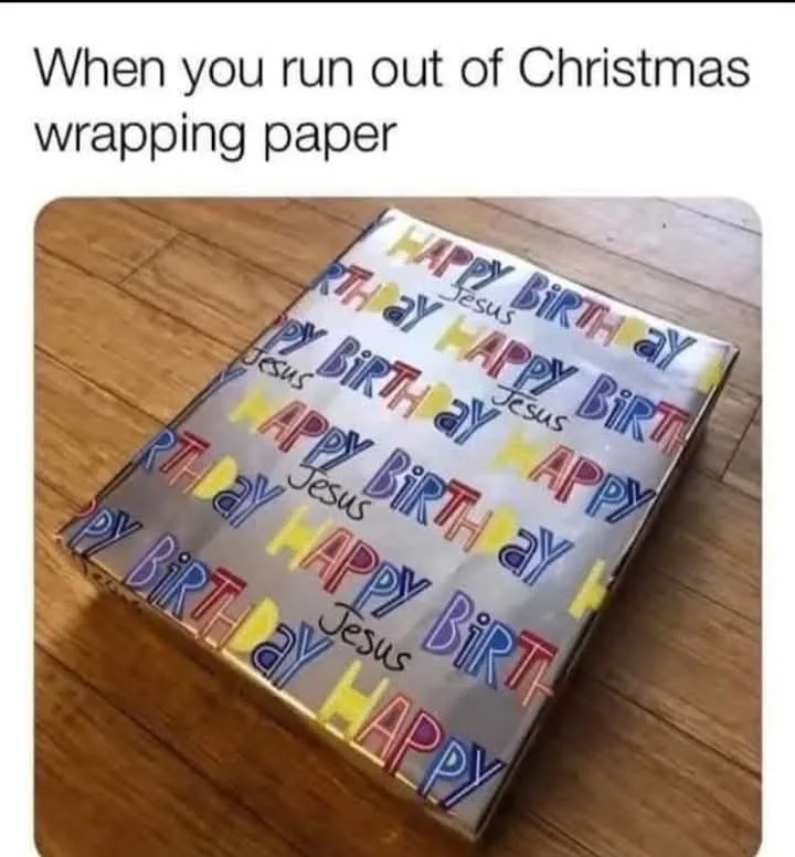 A gift box wrapped in birthday-themed paper featuring repeated 'HAPPY BIRTHDAY' text in colorful fonts, with the word…