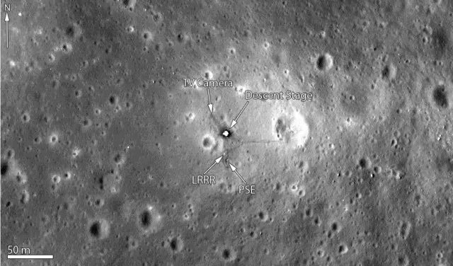 A black-and-white lunar surface image shows a central landing site with arrows pointing to labeled components: 'TV Camera'…