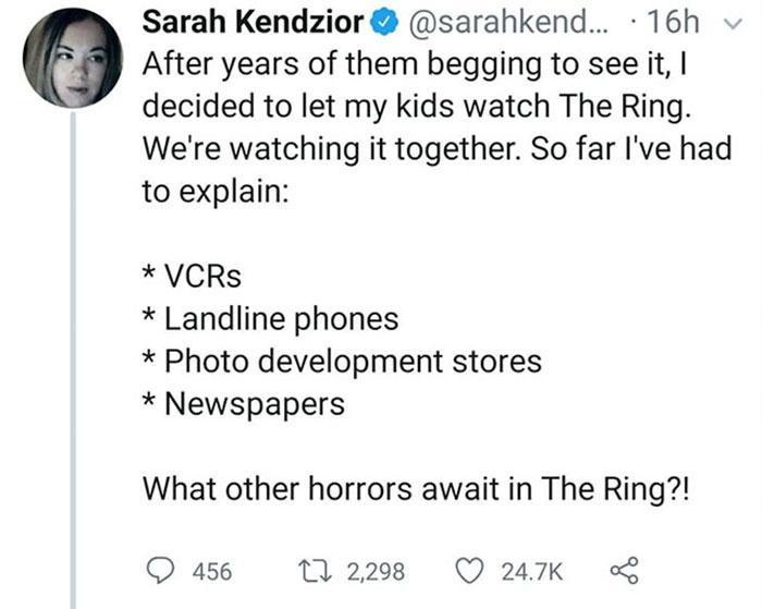 A screenshot of a tweet by Sarah Kendzior showing her listing things her kids had to explain to understand the 2002 horror…
