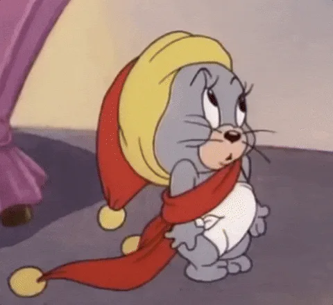 A six-panel cartoon sequence shows a baby Tom from 'Tom and Jerry' wearing a red and yellow jester hat and diaper. He starts…