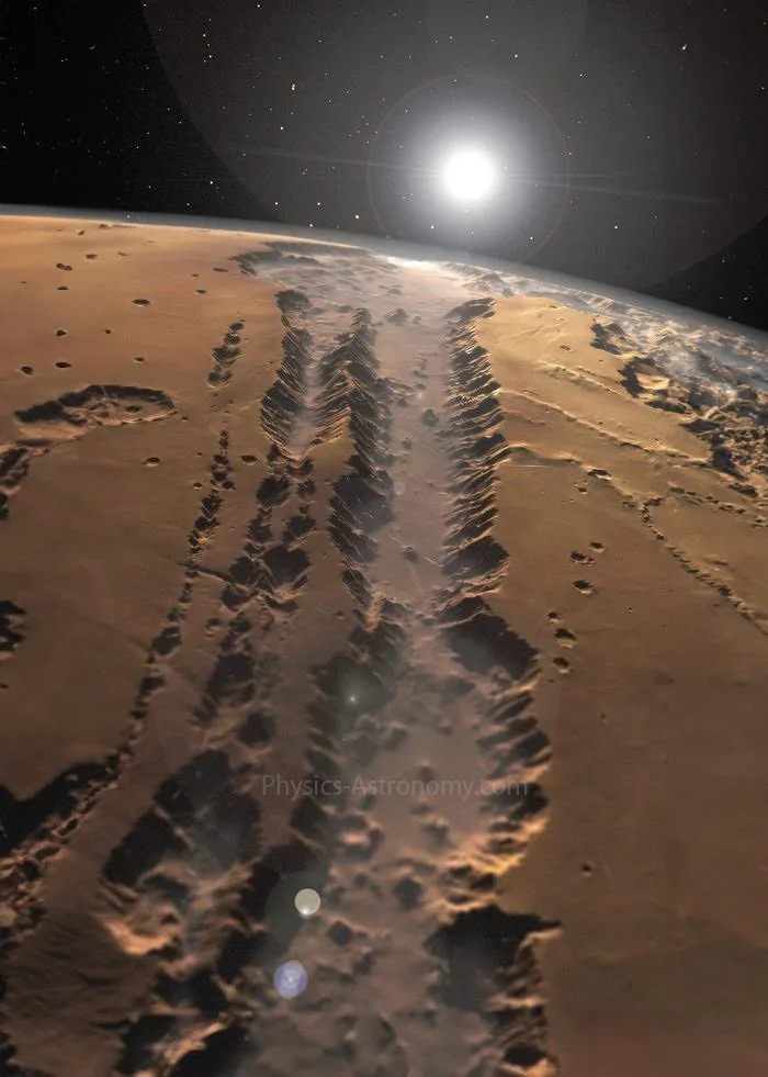 A space view of Mars showing long, winding, dark ridges across its rusty surface, with a bright sun and stars in the black…