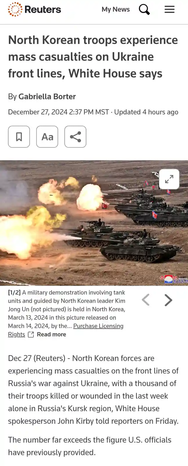 A Reuters news article screenshot shows a photo of North Korean tanks firing in a military demonstration, overlaid with the…