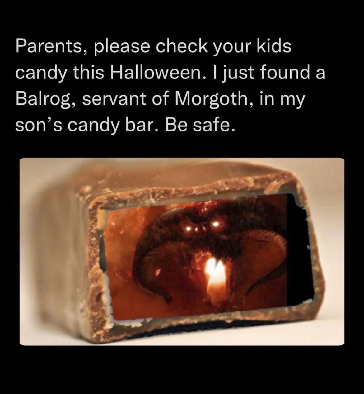A broken-open chocolate candy bar reveals a dark, fiery creature with glowing eyes and a flame in its mouth, resembling a…