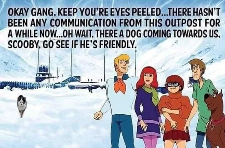 The image shows the Scooby-Doo gang—Fred, Daphne, Velma, Shaggy, and Scooby-Doo—standing in a snowy landscape with a remote…