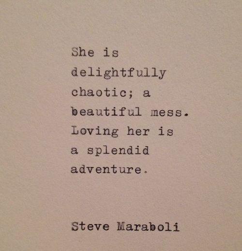 A close-up photo of typewritten text on light-colored paper. The text reads: 'She is delightfully chaotic; a beautiful mess…