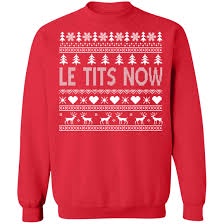 A red Christmas sweater with a white festive pattern of trees, hearts, and reindeer. The text 'LE TITS NOW' is printed in…