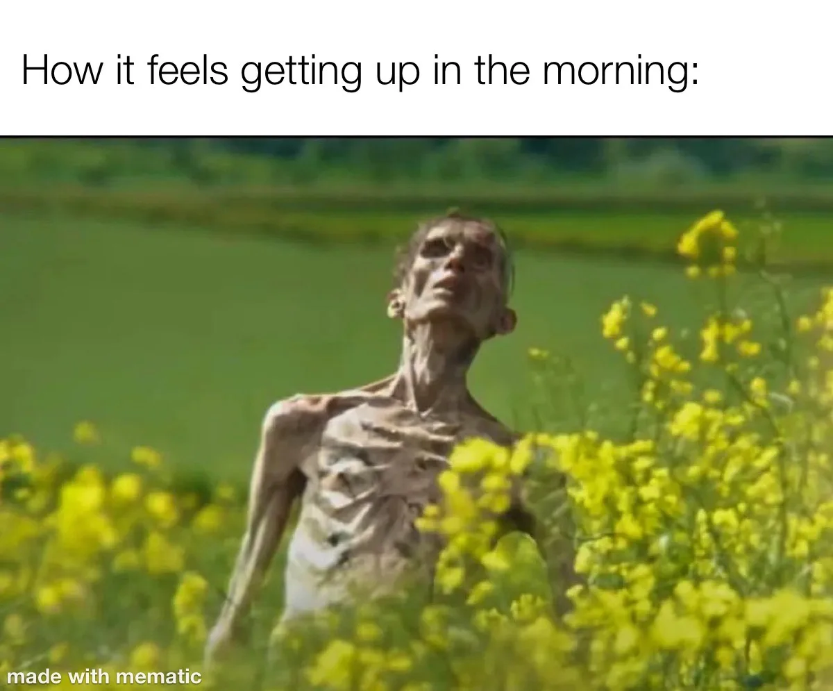 A severely emaciated, skeletal human figure stands in a field of yellow flowers, head tilted back with a weary expression…