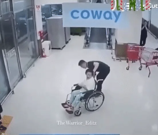 A six-panel security camera sequence shows a man pushing a woman in a wheelchair through a store entrance. He stops, turns…